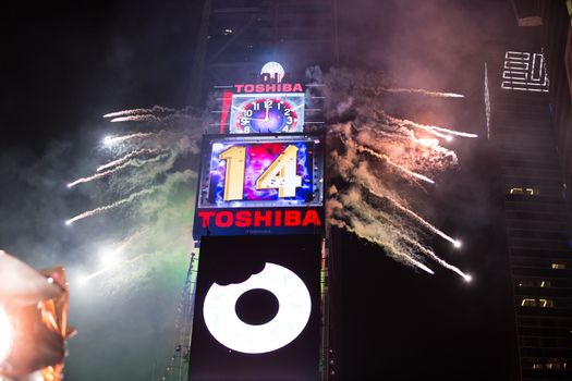 UNITED STATES, New York: Confetti fly over the Time Square after the clock strikes midnight during the new year celebrations on January 1, 2016 in New York City.