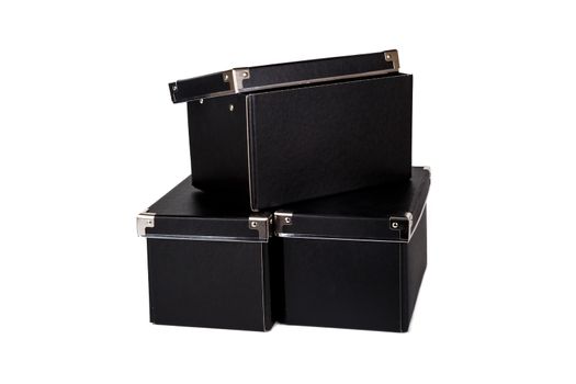 Close up view of three black cardboard box isolated on white background.