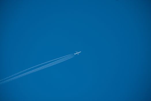 Shot of a jet plane high in the blue sky, France