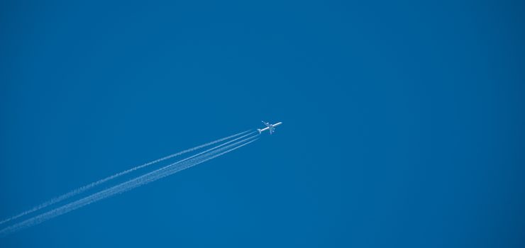 Shot of a jet plane high in the blue sky, France