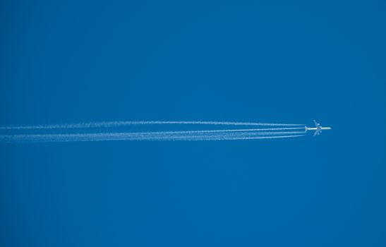 Shot of a jet plane high in the blue sky, France