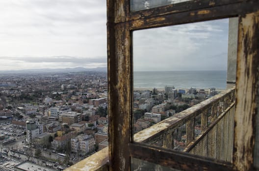 Italian city reflected on a rusty mirror