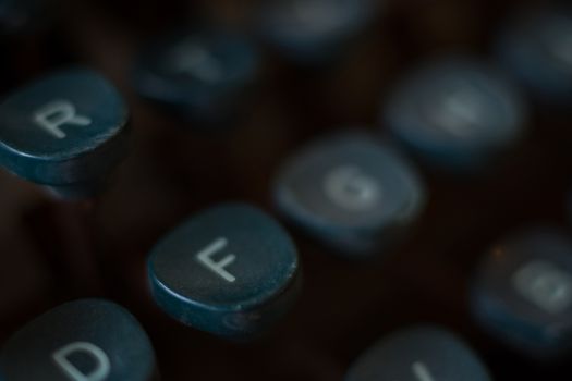 Typewriter Keys Blurred Close Up Image. Keyboard Detail of a Vintage Rusty Typewriter. Typewriter Buttons Background. Shallow Depth of Field.
