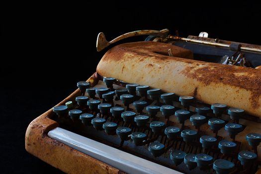 Typewriter, Waiting for Inspiration. Vintage Rusty Typewriter Machine. Journalist Equipment. Typewriter Close Up Isolated on Black Background.