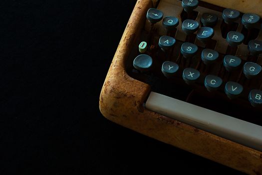 Typewriter, Waiting for Inspiration. Vintage Rusty Typewriter Machine. Journalist Equipment. Typewriter Close Up Isolated on Black Background.