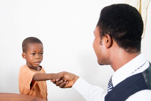 this  gentleman greets the little boy who seems to be afraid of him