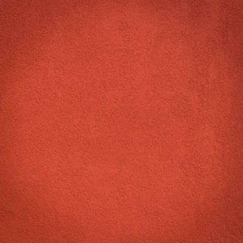 Red wall background and texture with vignetting and blank copyspace for text or advertising.