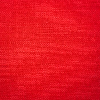 Rustic canvas fabric texture in red color.