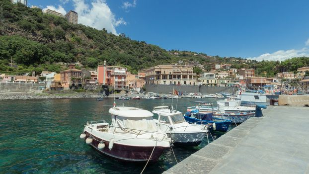 View of Sea port, boats and houses at Acireale - Italy.