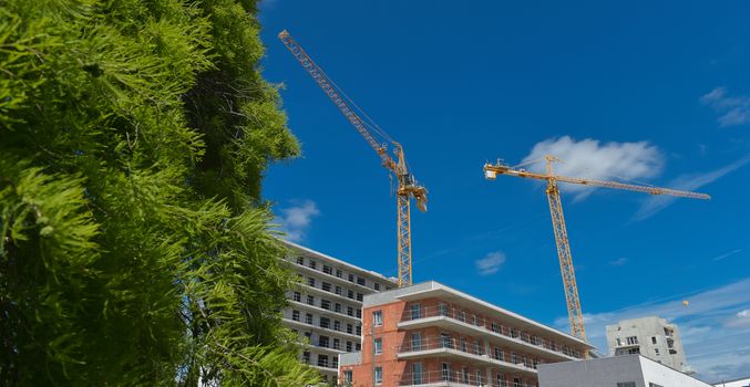 Building, House under construction and crane, France