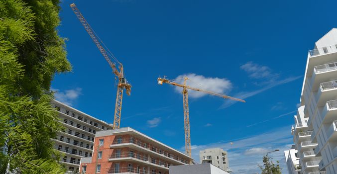 Building, House under construction and crane, France