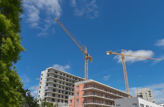 Building, House under construction and crane, France
