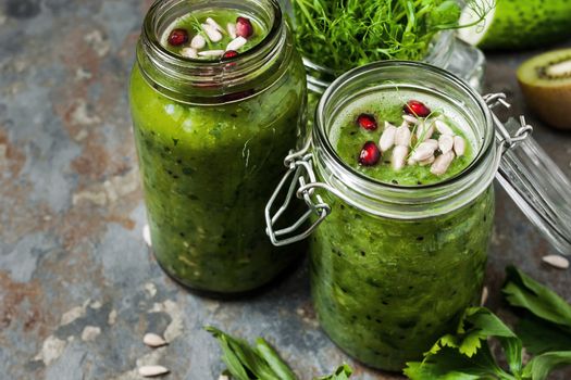 Vegan smoothie in a glass jars on the rustic table