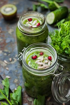 Vegan smoothie in a glass jars on the rustic table