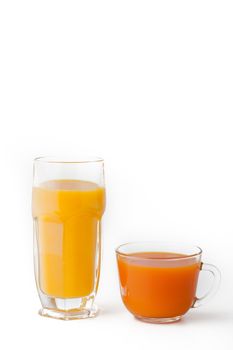 Glasses of juice on the white background