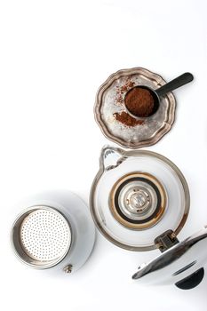 Coffee maker and vintage metal plate with coffee on the white background vertical