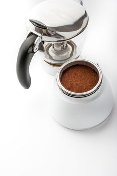 Open coffee maker with coffee on the white background vertical