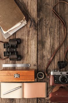 Traveler  things on the wooden background top view