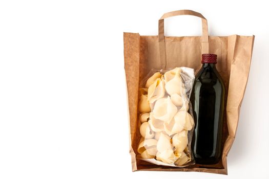 Pasta and olive oil inside a paper bag