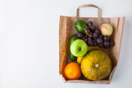 Assorted fruit inside a paper bag