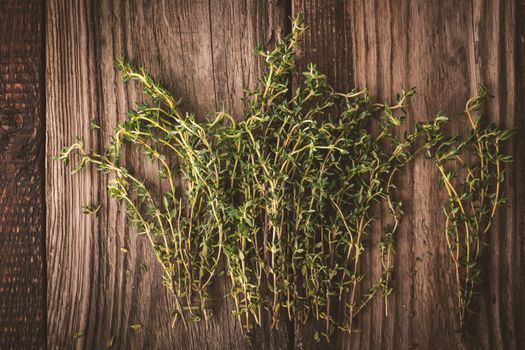 Thyme on the old wooden board horizontal