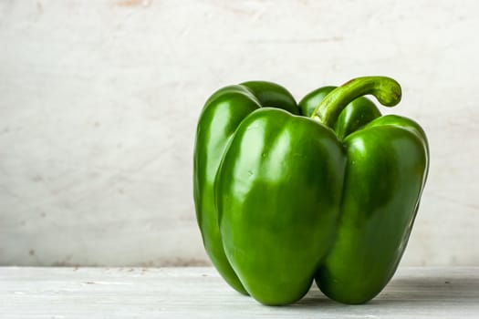 Green pepper on the white table horizontal