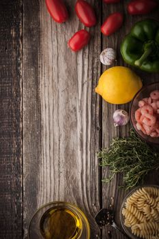 Vegetable with seasoning , shrimps and pasta on the wooden table top view