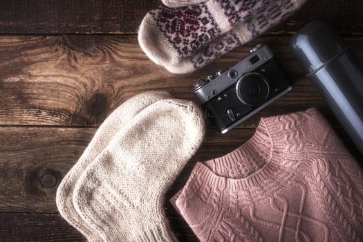 Winter traveler set on the wooden background top view