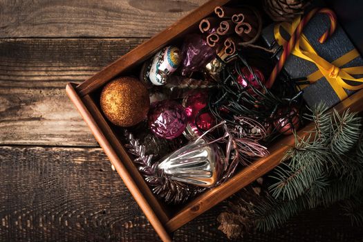 Wooden box with Christmas decorations and gift top view