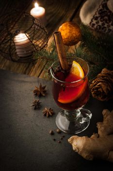 Mulled wine with spices and Christmas decorations vertical