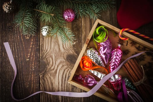 Wooden box with Christmas tree decoration and spices horizontal