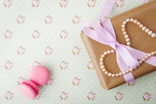 Gift box with pearls in a romantic vintage style in pastel colors horizontal