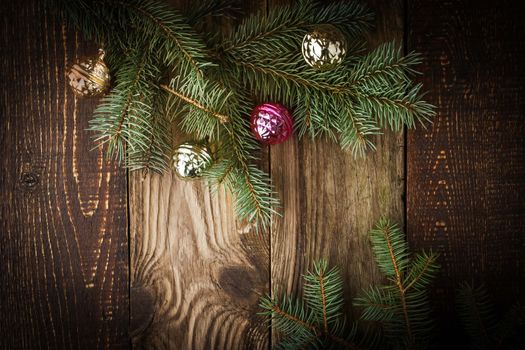 Fir tree with Christmas decoration  on the wooden board