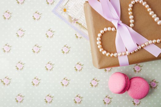 Gift box with pearls and card in a romantic vintage style in pastel colors horizontal