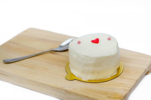 Homemade Coconut cream cake on wooden plate