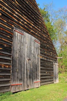 Barn Door Background - Closed barn doors on a farm building, with old weathered wooden planks