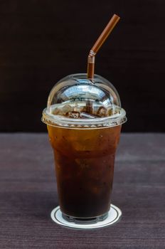 Cold coffee drink with ice on a table