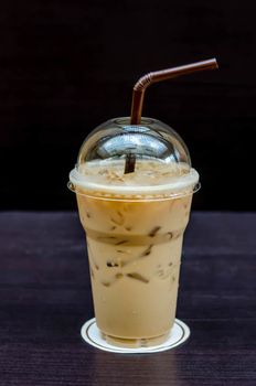 Cold coffee drink with ice on a table
