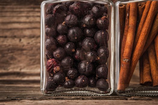 Dried currants and cinnamon on a wooden table horizontal