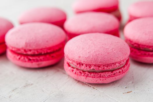 Pink macaroon on a white table horizontal