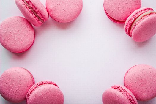 Pink macaroon on a white tablecloth horizontal