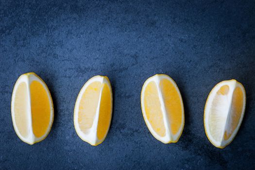  Slices of lemon on a stone table horizontal