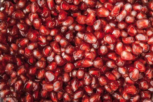 Pattern of red pomegranate seeds horizontal