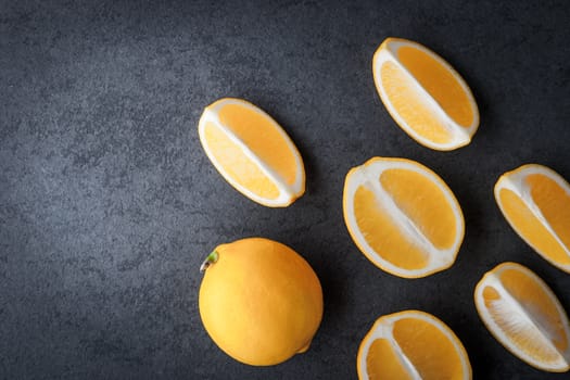 Yellow lemons on a blue stone table horizontal