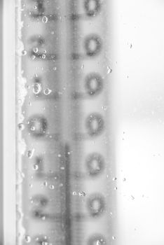 Thermometer for window glass with raindrops vertical 