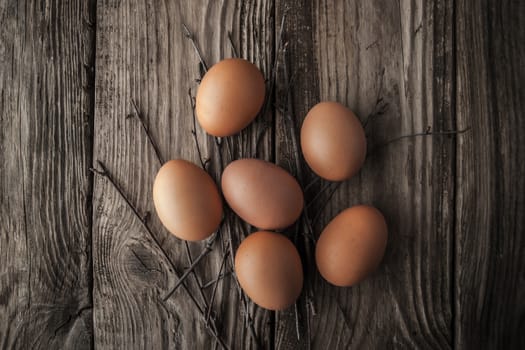 Chicken eggs on a wooden table horizontal