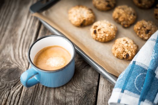 Oatmeal cookies and coffee cup on a wooden table horizontal