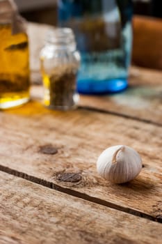 Garlic on a wooden table vertical