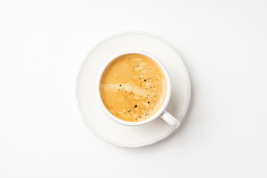 Coffee in ceramic cup on a white table horizontal