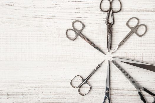 Set of scissors on a wooden table horizontal